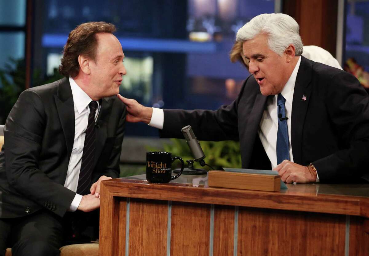 Billy Crystal, left, who was Jay Leno's first guest when he took over NBC's "Tonight Show" in May 1992, returned as his last guest Thursday when Leno ended his two-decade run on late night TV in Burbank, Calif.