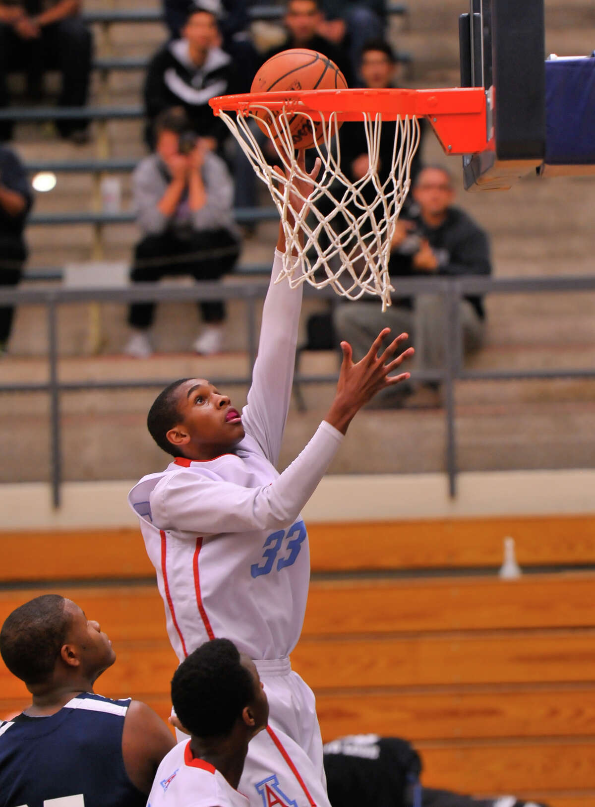 Antonian's Jamel Bradley scores two points in a Feb. 6, 2014 game vs. Central Catholic. The Buttons won 66-55.