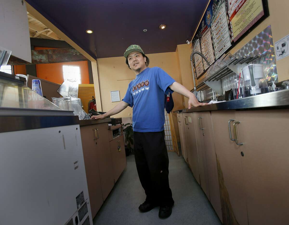 Jigmey Kunsang makes protein shakes for customers on Wednesday, February 5, 2014 in San Francisco, Calif. Kunsang gets paid minimum wage and finds it hard to make ends meet.