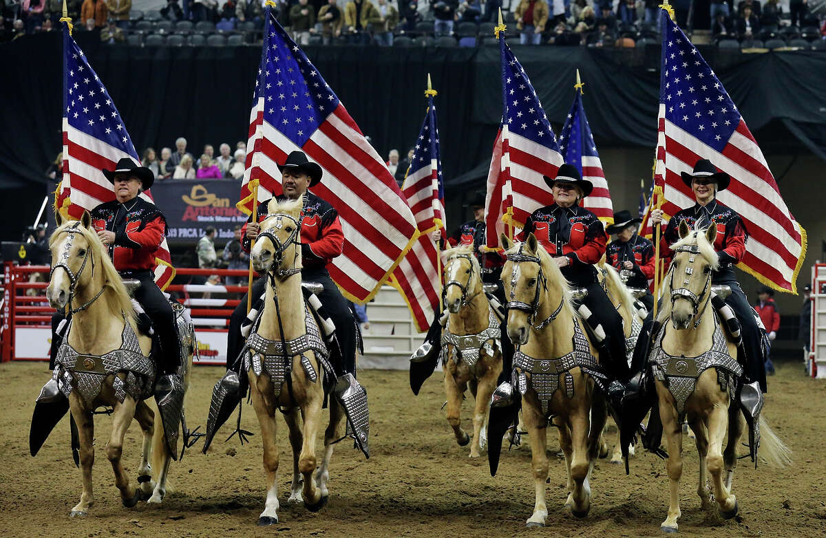 Palomino Patrol trot into rodeo arena on vintage silver saddles