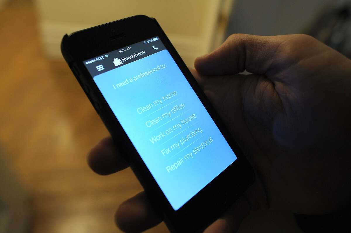 Tristan Zier of Handybook shows his company's app that allows users to order house cleaners, handymen, electritions, and plumbers online, at his home in San Francisco, CA Friday, February 7, 2014.