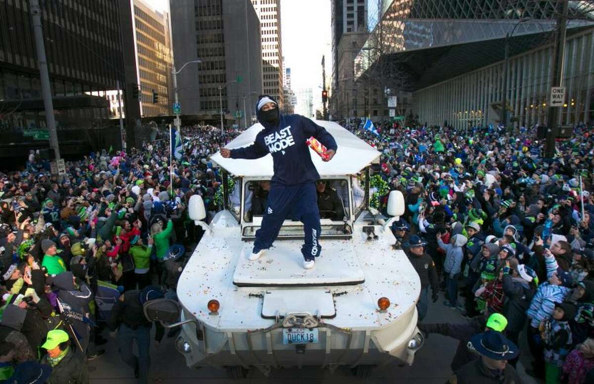 Feb. 5: 700,000 rally in Seattle for Super Bowl victory Seattle had never seen anything like it. More than 700,000 people braved sub-freezing temperatures and swarmed downtown Seattle for the Seahawks' victory parade, having destroyed the Broncos 43-8 for their first-ever Super Bowl championship. Marshawn Lynch stole the show by throwing Skittles, chugging Fireball liquor and banging a drum from the hood of a Ride the Ducks vehicle. Photo: Joshua Trujillo/seattlepi.com