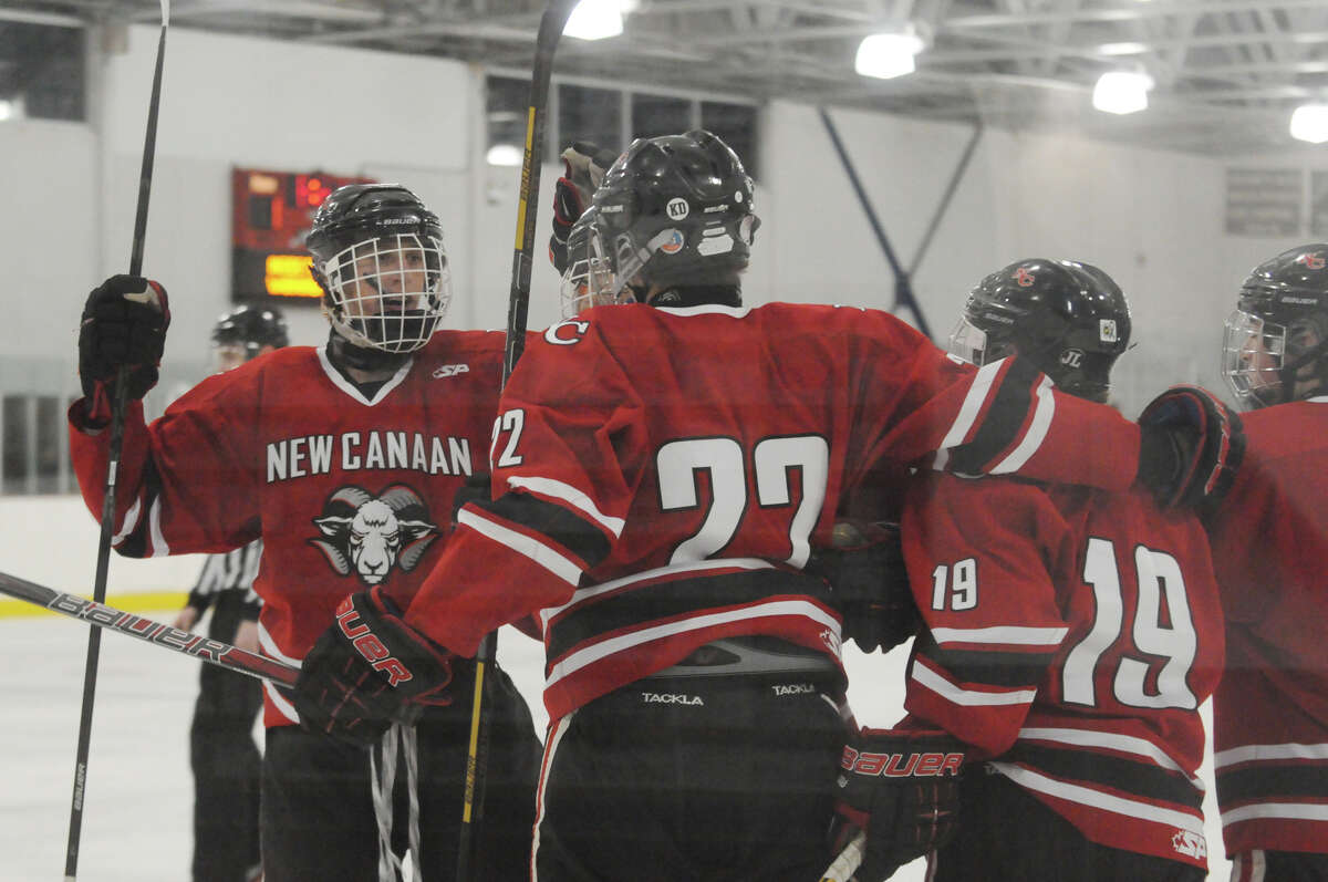 New Canaan scores as Greenwich hosts New Canaan High School in a boys hockey game at Dorothy Hamill Rink in Greenwich, Conn., Feb. 8, 2014.