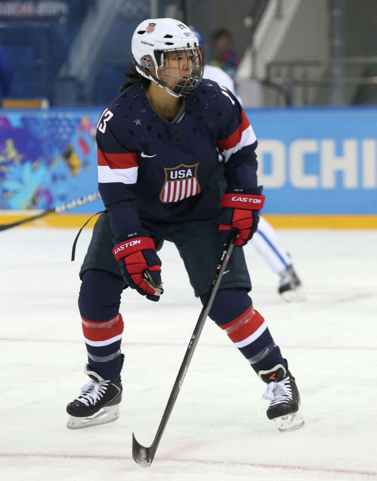 SOCHI, RUSSIA - FEBRUARY 08: Julie Chu #13 of United States looks on against Finland during the Women's Ice Hockey Preliminary Round Group A Game on day 1 of the Sochi 2014 Winter Olympics at Shayba Arena on February 8, 2014 in Sochi, Russia. (Photo by Bruce Bennett/Getty Images) ORG XMIT: 461426669