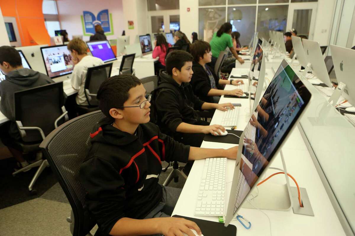 Students make use of the computers at the Bibiliotech, first all-digital public library system. Use of the facility has grown since it opened last summer. The county added a new site at the courthouse and others are planned.