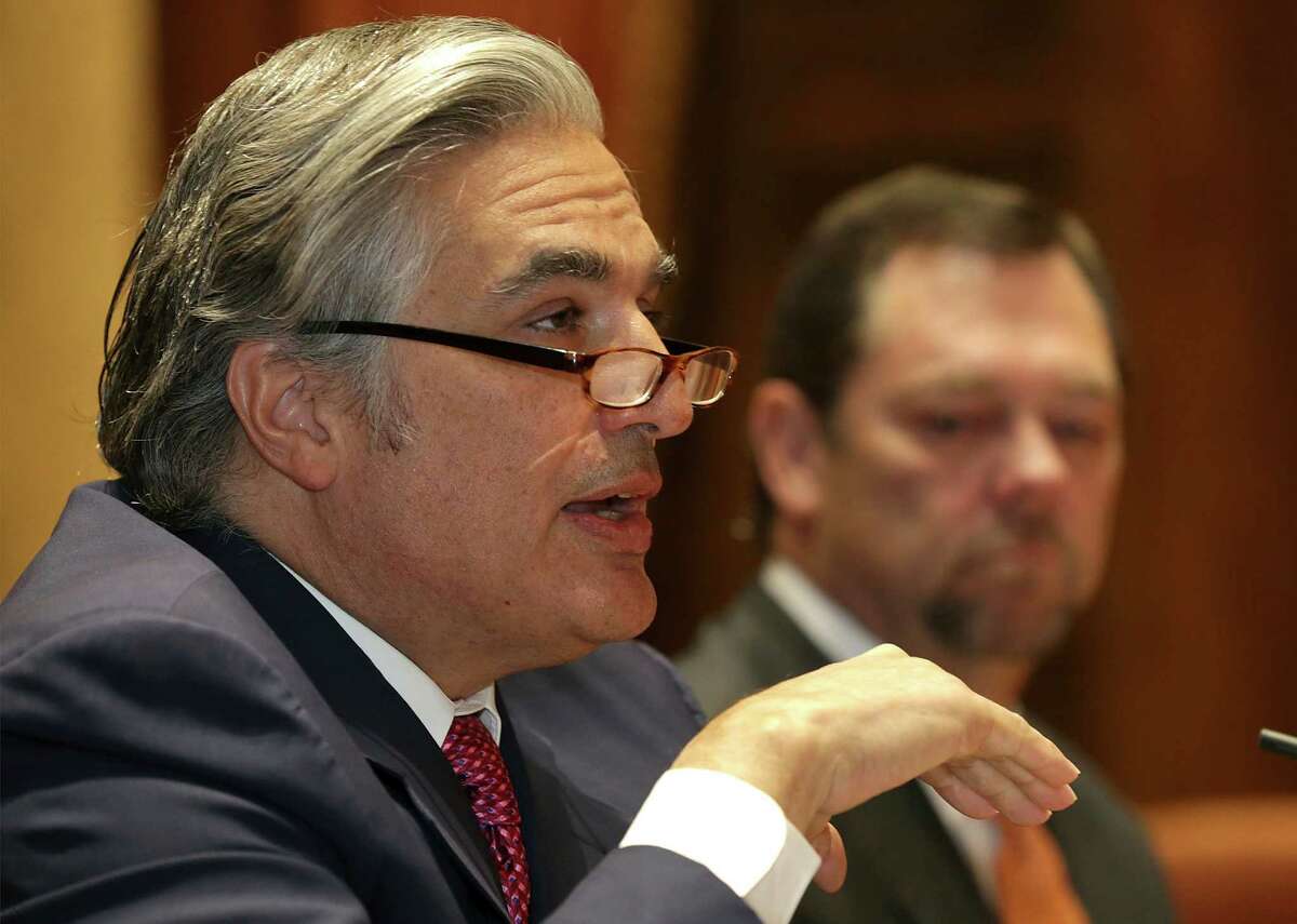 Chancellor Francisco G. Cigarroa, M.D., left, announces that he will step down as head of The University of Texas System after a five-year tenure, in Austin, TX. At right is UT System Board of Regents Chairman Paul Foster. Monday Feb. 10. 30, 2014.