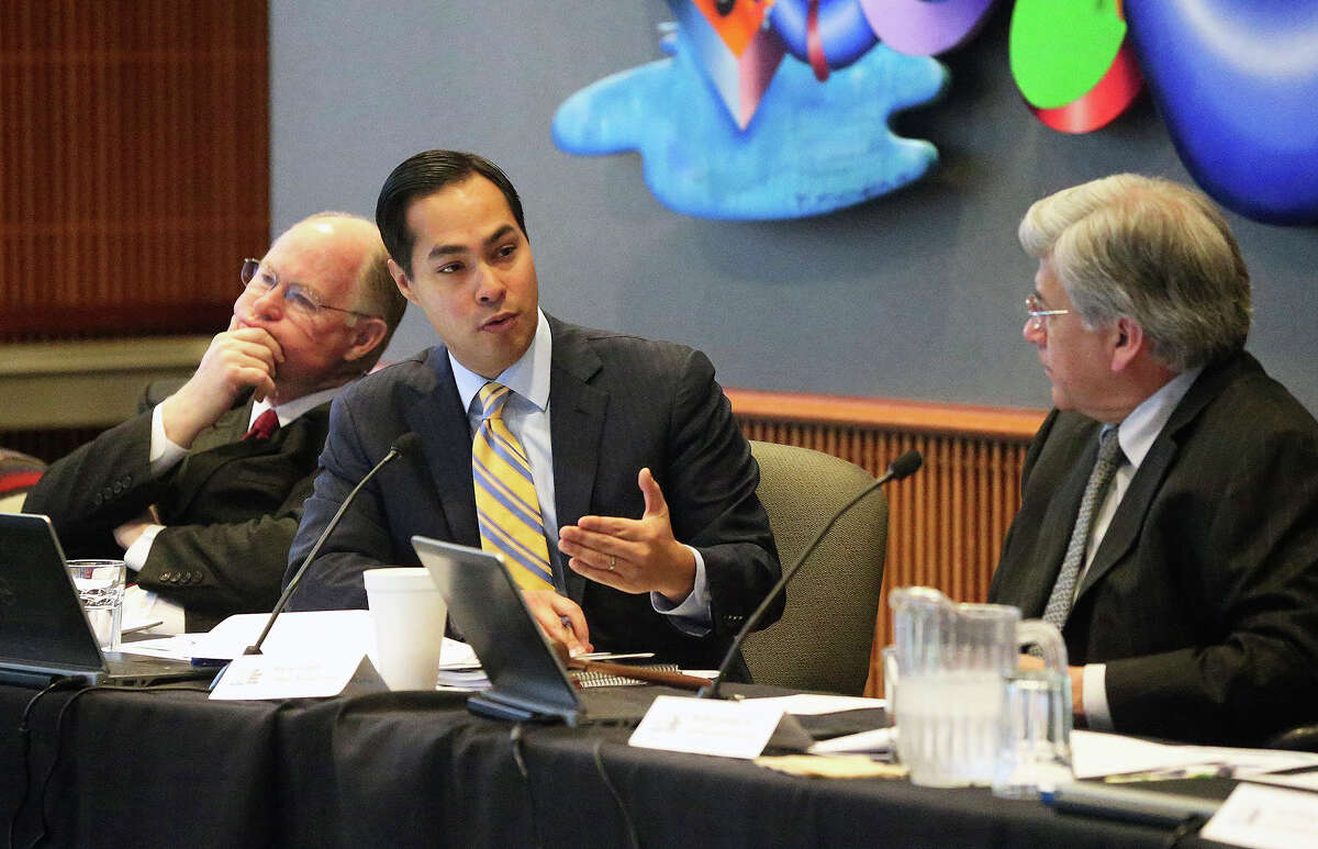Mayor Julian Castro questions President and CEO Robert Puente about his proposals as the SAWS board meets on February 10, 2014 before the public to hear a recommendation to drop plans for pipeline projects and instead turn to emphasis on desalination of brackish water. Listening on the left is Board of Trustees member W. Reed Williams and right Berto Guerra, Jr., Chairman.
