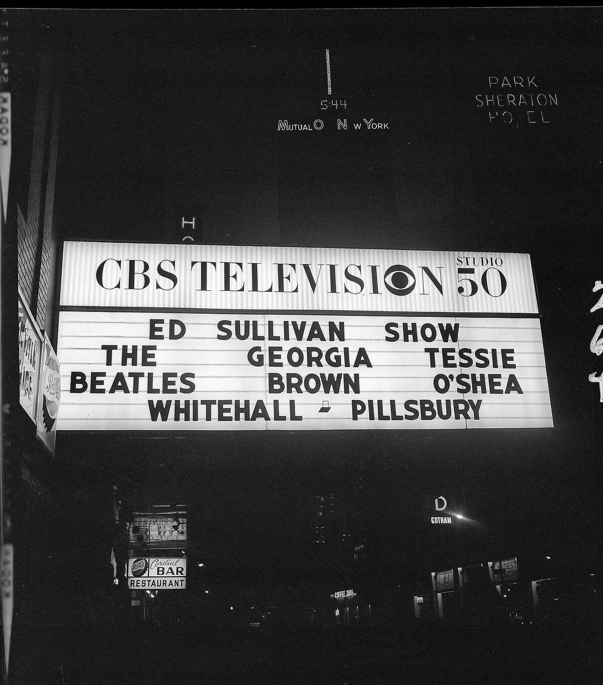 'The Ed Sullivan Show' marquee outside of CBS's Studio 50 in New York City lists the show's headlining acts.