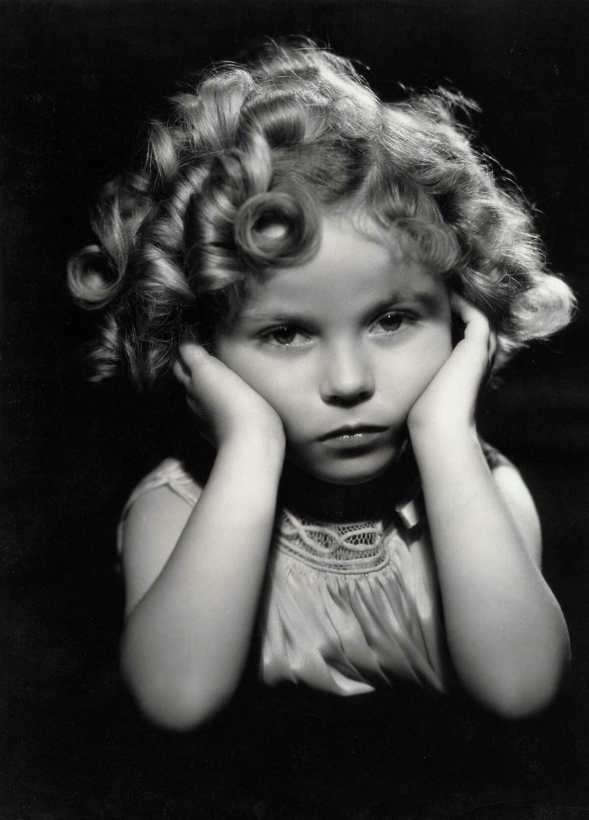 1933: Child actress Shirley Temple in one of her famous poses.