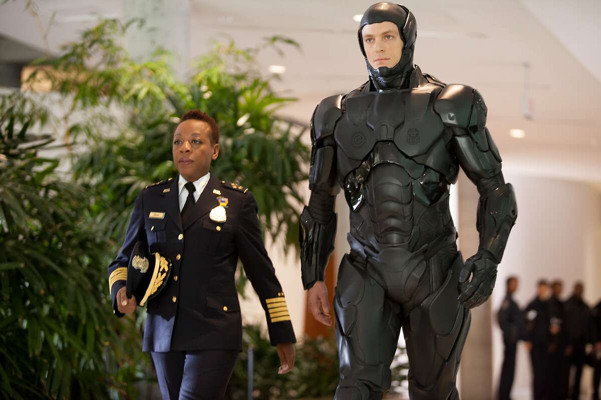 This image released by Columbia Pictures shows Marianne Jean-Baptiste, left, and Joel Kinnaman in a scene from "RoboCop." (AP Photo/Columbia Pictures - Sony, Kerry Hayes)