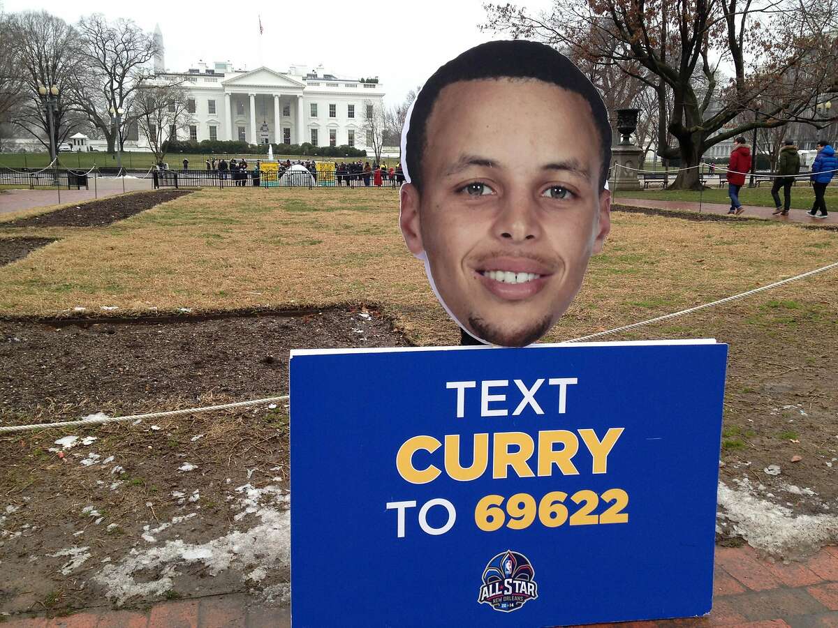 A placard urging fans to text their All-Star vote for Golden State Warriors guard Stephen Curry is seen outside the White House in 2014.