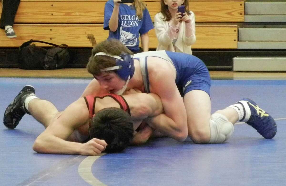 Fairfield Ludlowe's Bobby Clark, on top, during his win by pin over Fairfield Warde's Aaron Beinstein at 132 pounds on Tuesday, Feb. 11 in an FCIAC wrestling match at Ludlowe won by the Mustangs 46-25. They wrestled at 132 pounds.