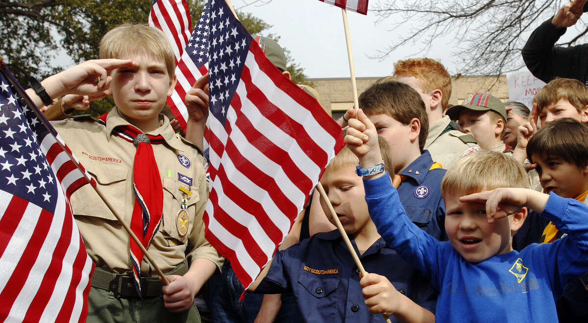 Young scouts gather in a rally in front of the Boy Scouts of America National Headquarters in Dallas. The BSA said it lost 6 percent of its membership in the past year.