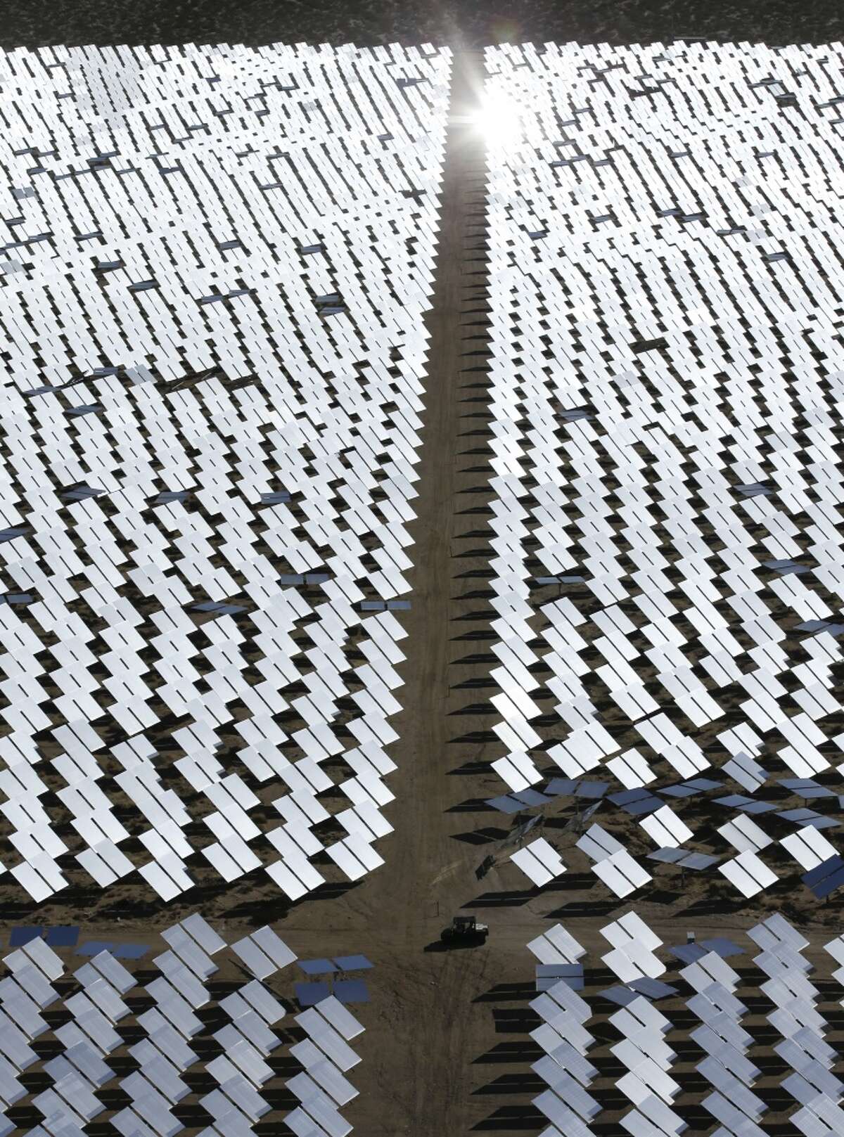 Some of the 300,000 computer-controlled mirrors, each about 7 feet high and 10 feet wide, reflect sunlight to boilers that sit on 459-foot towers. The sun's power is used to heat water in the boilers' tubes and make steam, which in turn drives turbines to create electricity in Primm, Nev. The Ivanpah Solar Electric Generating System, sprawling across roughly 5 square miles of federal land near the California-Nevada border, opened in 2014 after years of regulatory and legal tangles.