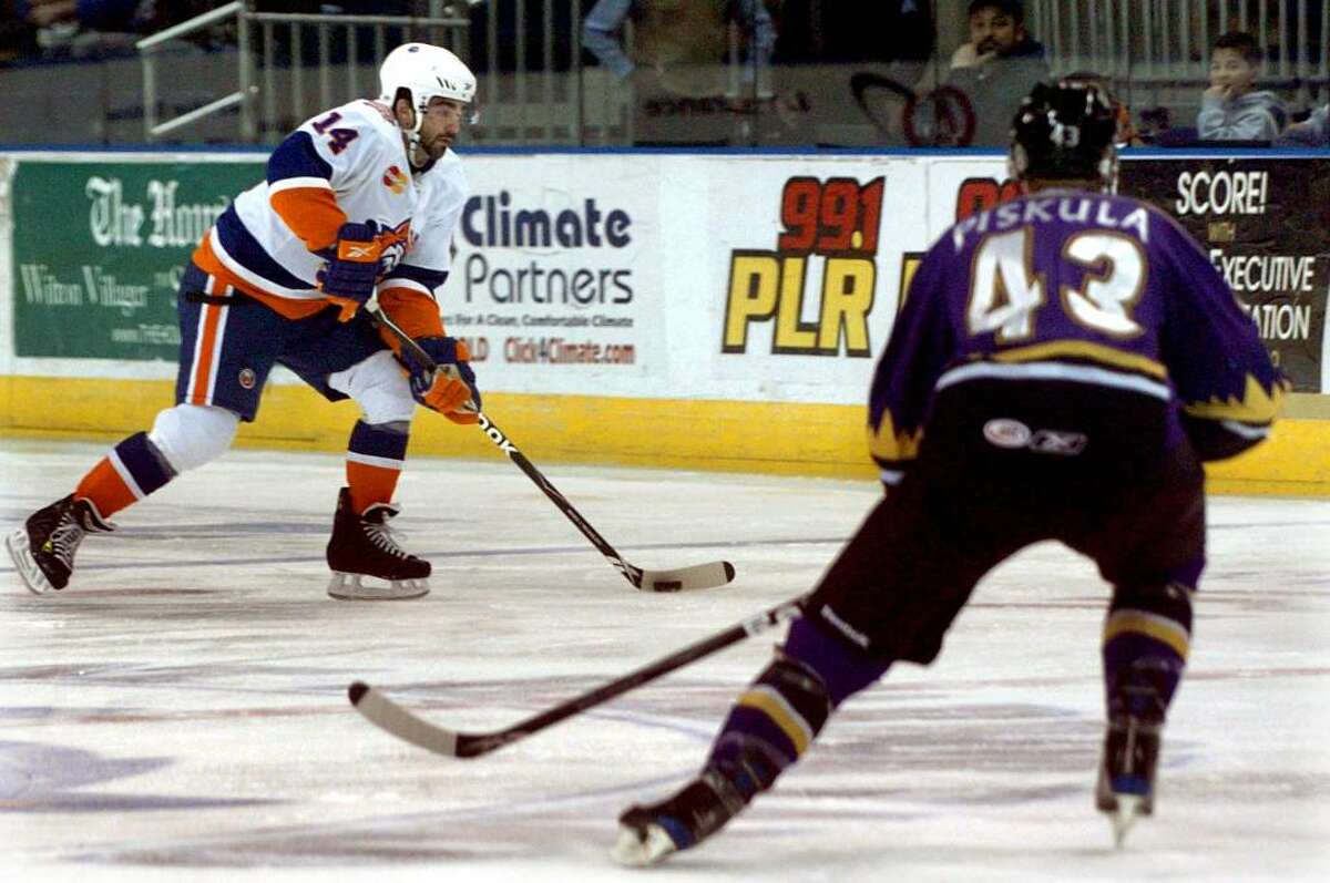 Sound Tiger's #14 Sean Bentivoglio moves the puck, during game action against Manchester at the Arena at Harbor Yard in Bridgeport, Conn. on Saturday Feb. 06, 2010.