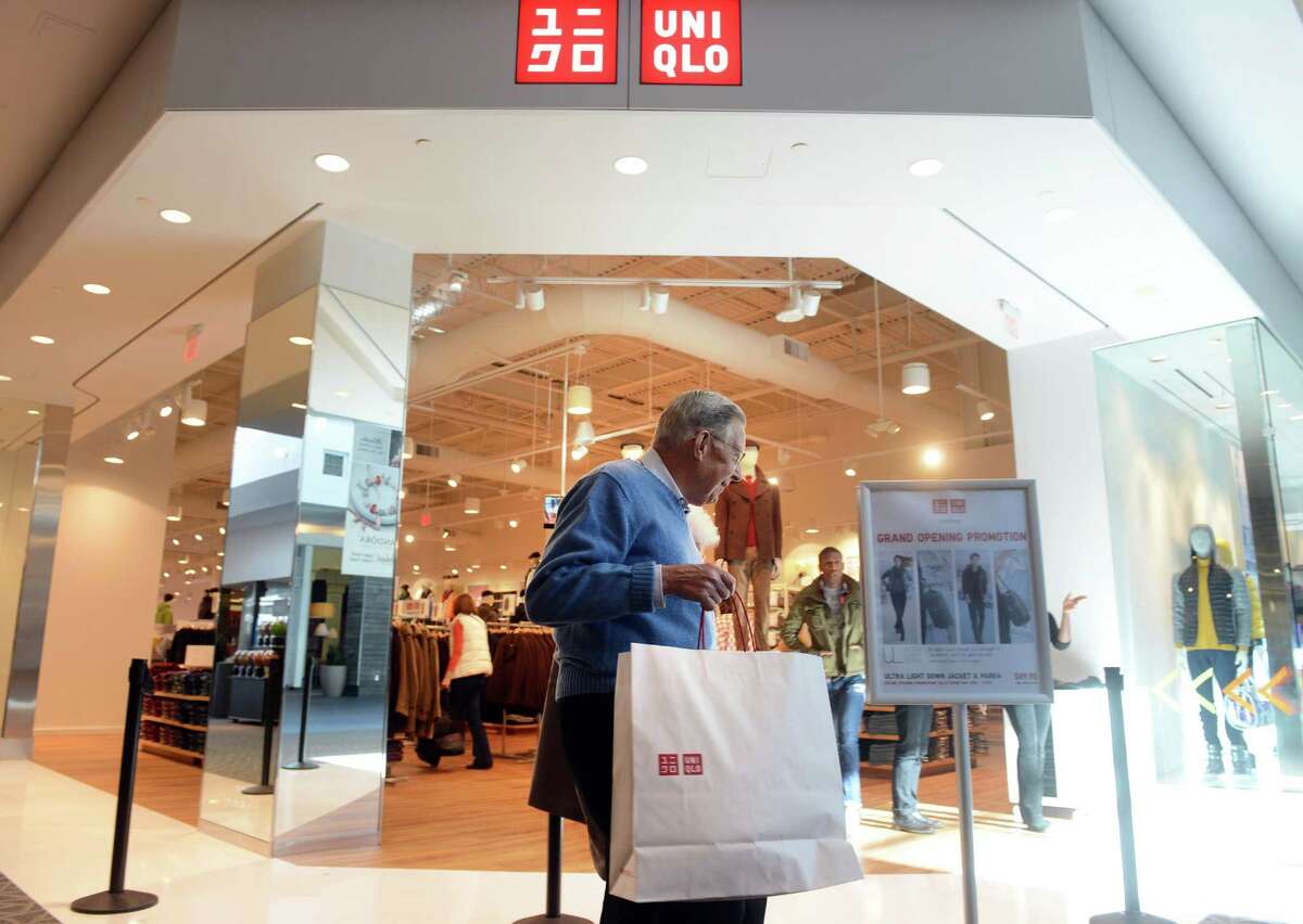 Edna and John Henchy, of Stratford, leave UNIQLO's new Westfield Trumbull Mall store Friday, Nov. 8, 2013 after shopping their grand opening sale. The store on Thursday, Feb. 13, announced plans to open a location at the Stamford Town Center in the spring.