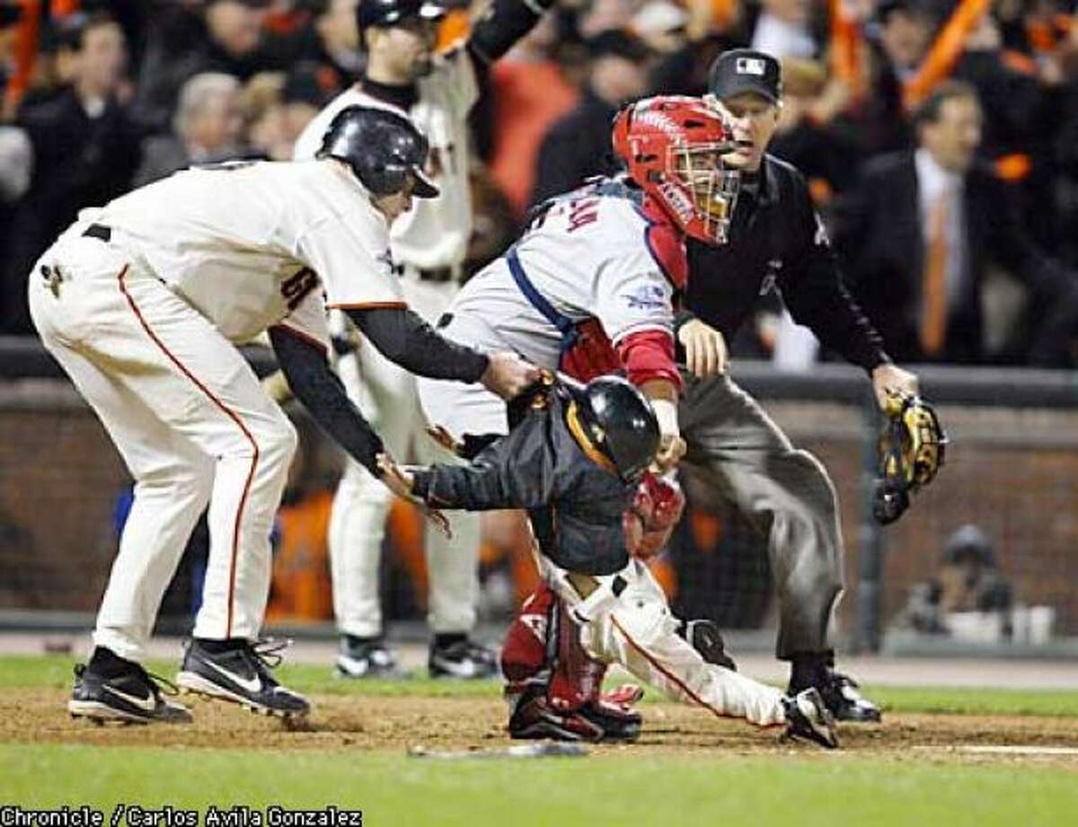 J.T Snow, left, enjoyed a 16-year major league career. A gold glove first baseman, Snow is most well-known for his quick-thinking during the 2002 World Series. There was a play at the plate and Darren Baker, the 3-year old son of San Francisco Giants manager Dusty Baker, ran by home plate to pick up a bat. Snow alertly swiped him by the back of his coat and got him out of harm's way.