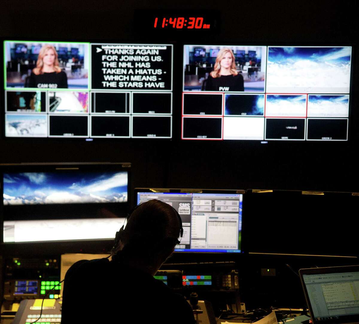 Director Kristen Coleman sits in front of monitors as she works at NBC in Stamford, Conn., on Thursday, February 13, 2014.