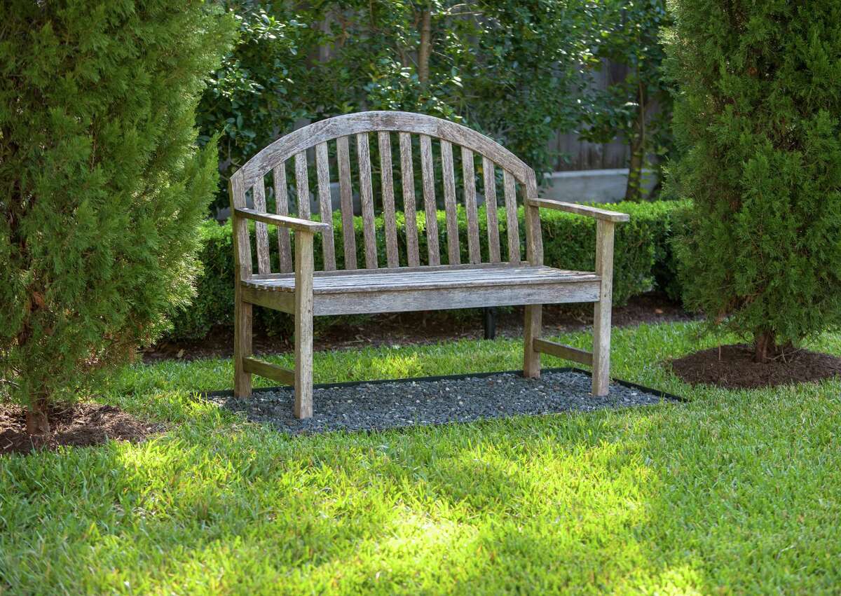Details and overalls of lush private River Oaks garden designed by David Morello. Bench in garden. Friday 10/05/12 (Craig H. Hartley/For the Chronicle)