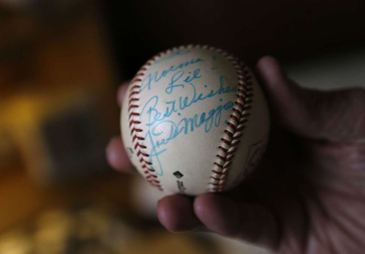 Lil Arnerich holds a personally autographed baseball given to him by Joe DiMaggio in his home in Alameda, Calif., on Wednesday, February 12, 2014. Lil Arnerich is a long-time time Alameda resident and former Oakland Oaks player who is has been involved in city politics and sports programs for 70 decades. He lives in the same home he has owned since 1949, and maintains contact with city government.