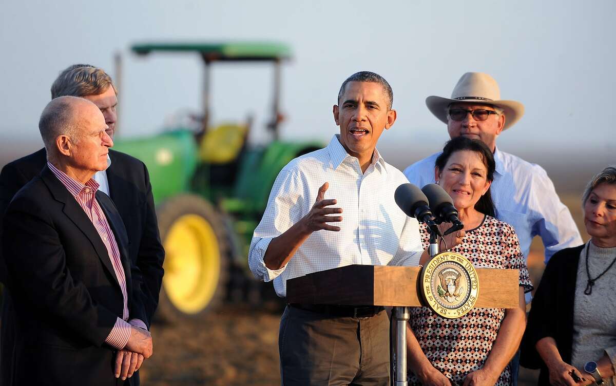 President Barack Obama speaks to the media, Friday, Feb. 14, 2014 in Los Banos, Calif. Farmers in California's drought-stricken Central Valley said the financial assistance President Barack Obama delivered on his visit Friday does not get to the heart of California's long-term water problems. (AP Photo/Los Angeles Times, Wally Skalij, Pool)