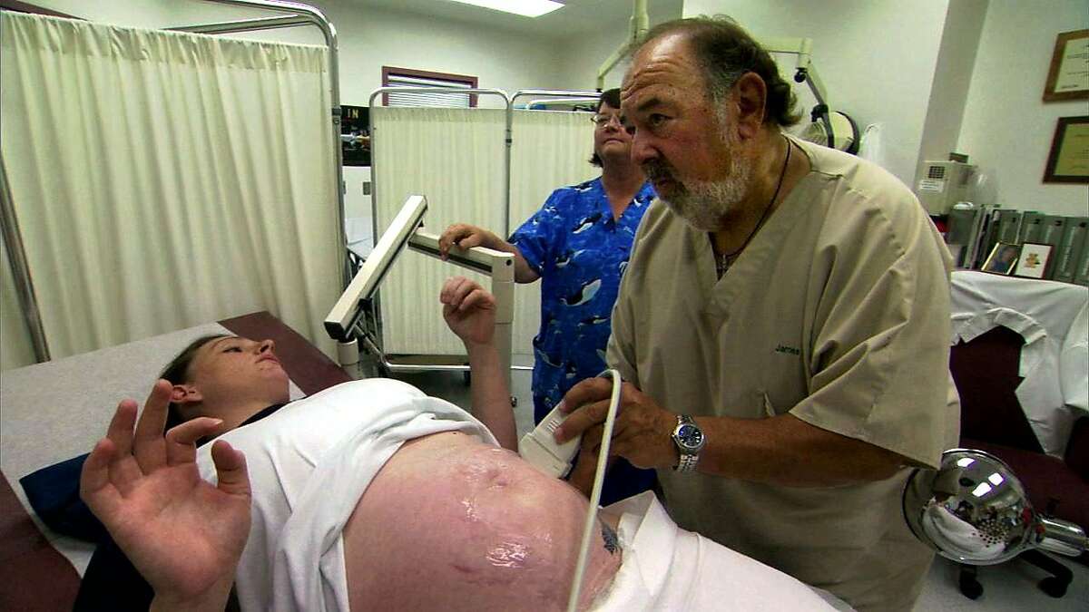 Dr. James Heinrich performs a prenatal exam on a pregnant inmate, filmed for the 2007 documentary "Lockdown: Women Behind Bars," at Valley State Prison for Women in Chowchilla, Calif. The OB-GYN ordered tubal ligations without state approval and is responsible for hundreds of other inmate sterilizations.