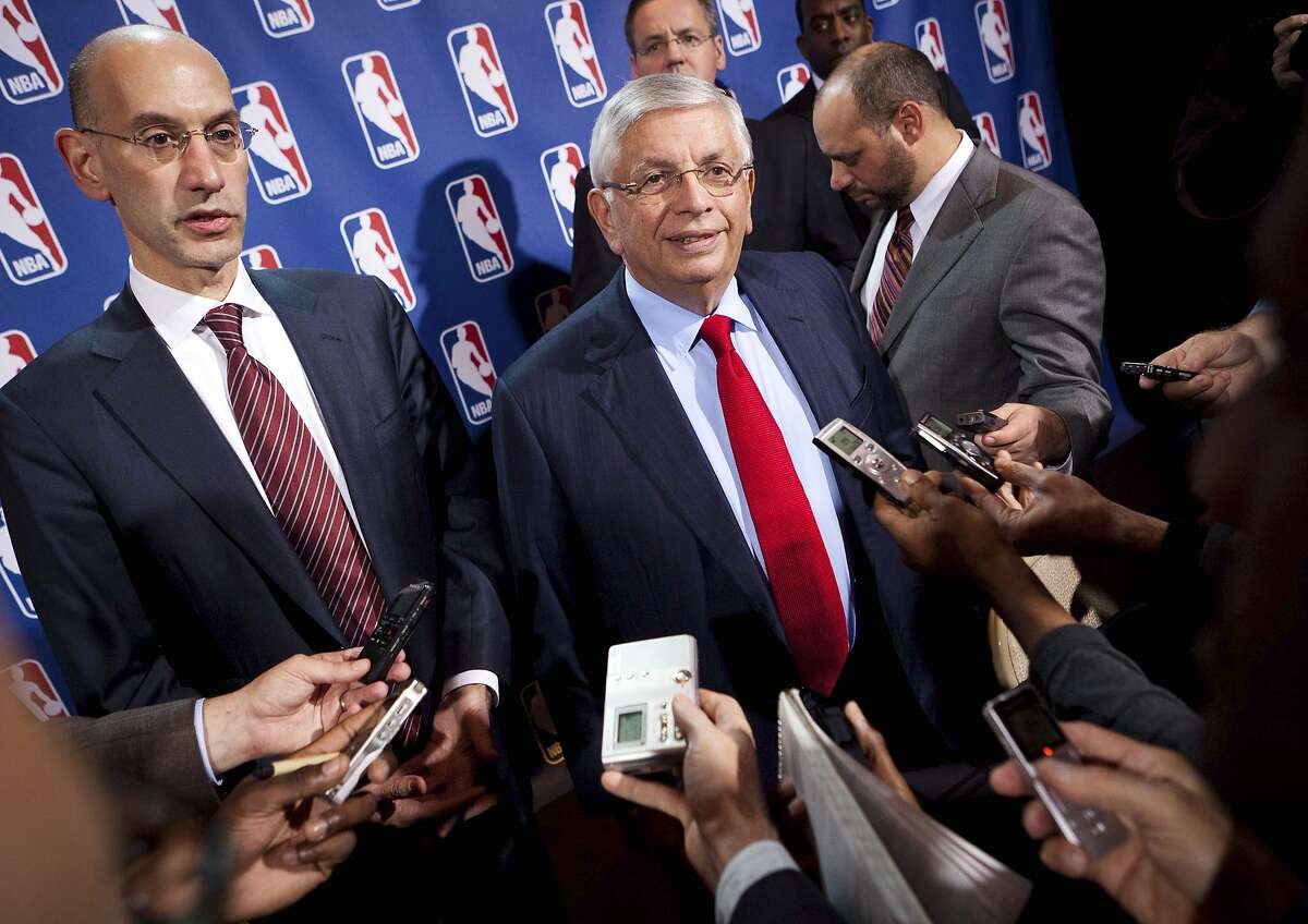 FILE - In this Nov. 10, 2011, file photo, NBA Commissioner David Stern, center, speaks to the news media alongside Deputy commissioner Adam Silver after a marathon meeting with the Players Association in New York. He is not in the Hall of Fame, he never played in an All-Star game and he is about a foot shorter than most NBA stars. But try to find an NBA legacy more lasting than Stern's, who is retiring Saturday, Feb. 1, 2014 after exactly 30 years on the job. Silver will be the head of the league. (AP Photo/John Minchillo, File)