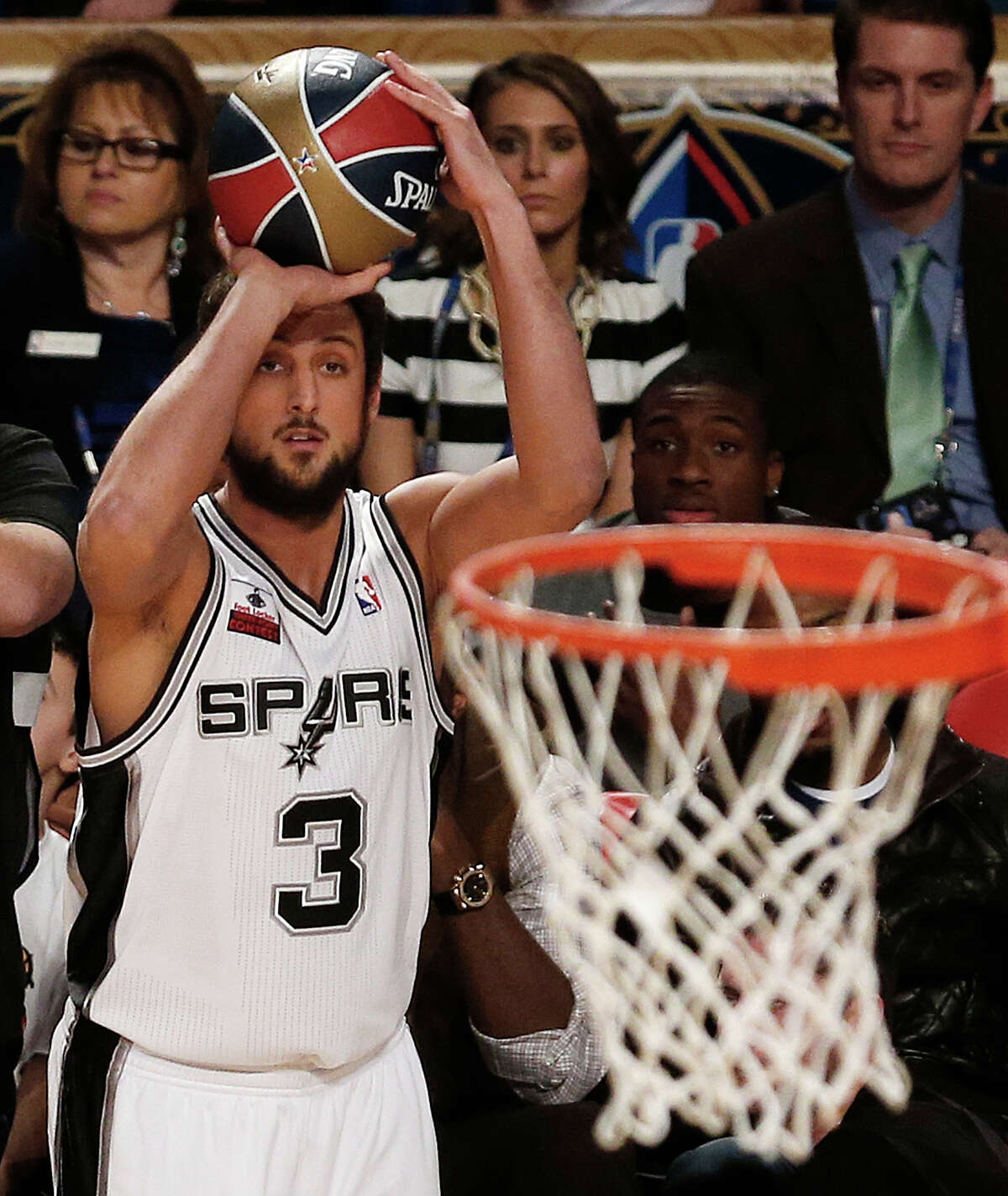 Marco Belinelli of the San Antonio Spurs shoots during the three-point contest during the skills competition at the NBA All Star basketball game, Saturday, Feb. 15, 2014, in New Orleans. (AP Photo/Bill Haber)