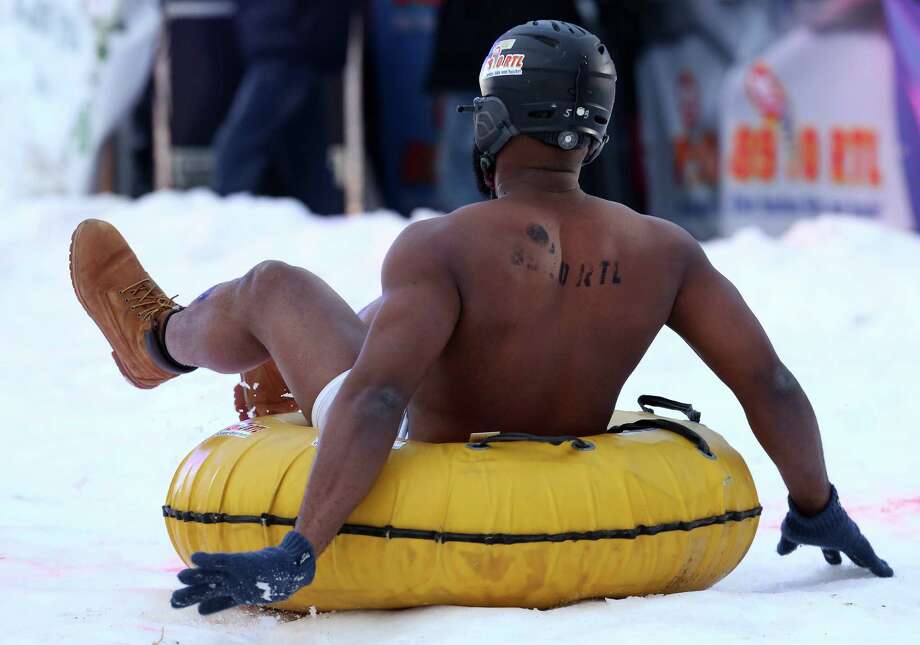 World news photos: Apathy protest, naked sledding and more