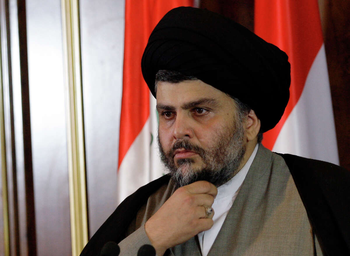 FILE - In this April 26, 2012, file photo, Shiite cleric Muqtada al-Sadr looks on during a press conference in Irbil, Iraq. One of Iraq's most influential Shiite clerics, Sadr, said he has decided to quit politics, distancing himself from any political movement that uses his name. (AP Photo/Khalid Mohammed, File)