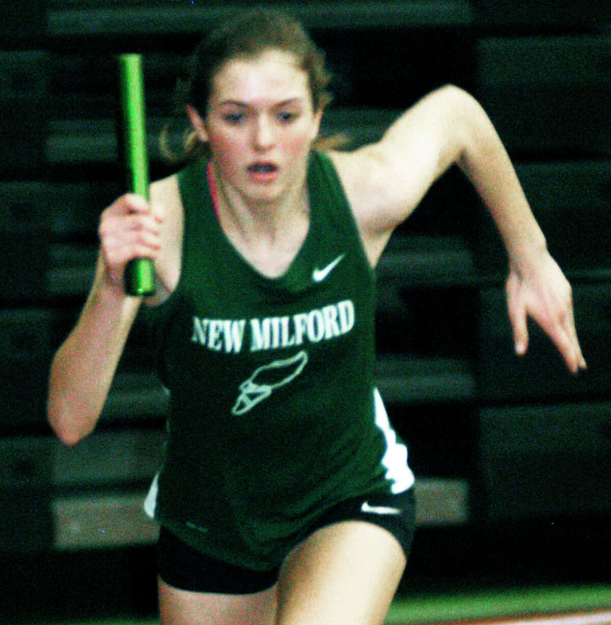 The Green Wave's Hannah Tower breaks quickly from the start to kick off the girls' victorious 4 x 400-meter relay run as New Milford High School indoor track competes Feb. 1, 2014 in the South-West Conference meet at Hillhouse High School in New Haven.