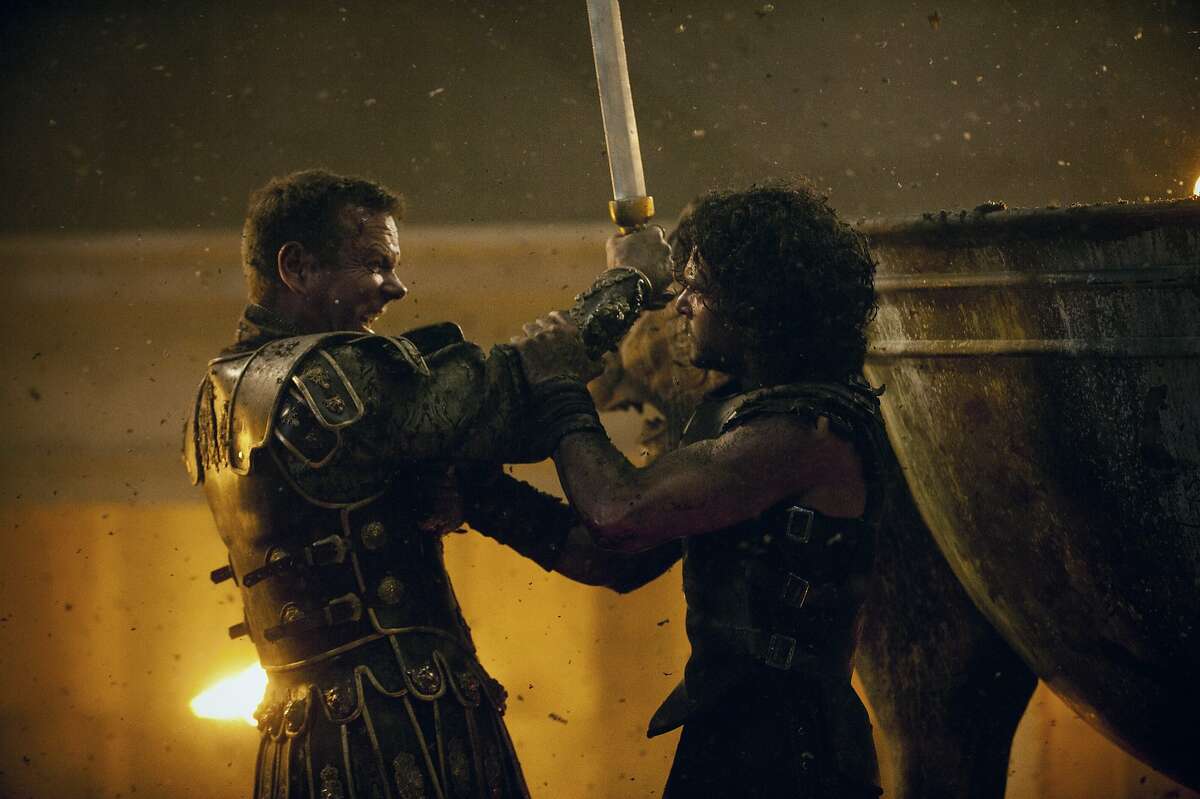 Milo (Kit Harington) and Corvus (Kiefer Sutherland) battle to the finish in TriStar Pictures' POMPEII.