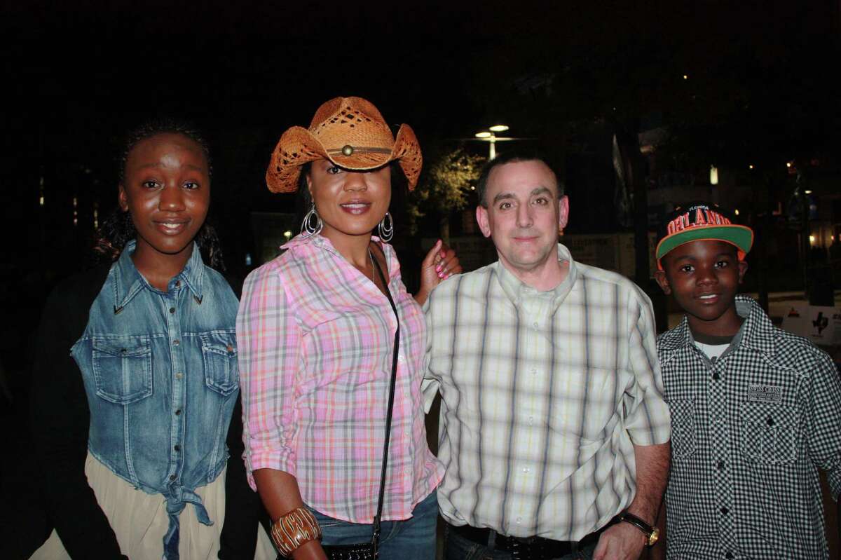Rodeo goers get ready to enjoy Pitbull in concert at the AT& Center during the San Antonio Stock Show & Rodeo on Wednesday, Feb. 19, 2014.