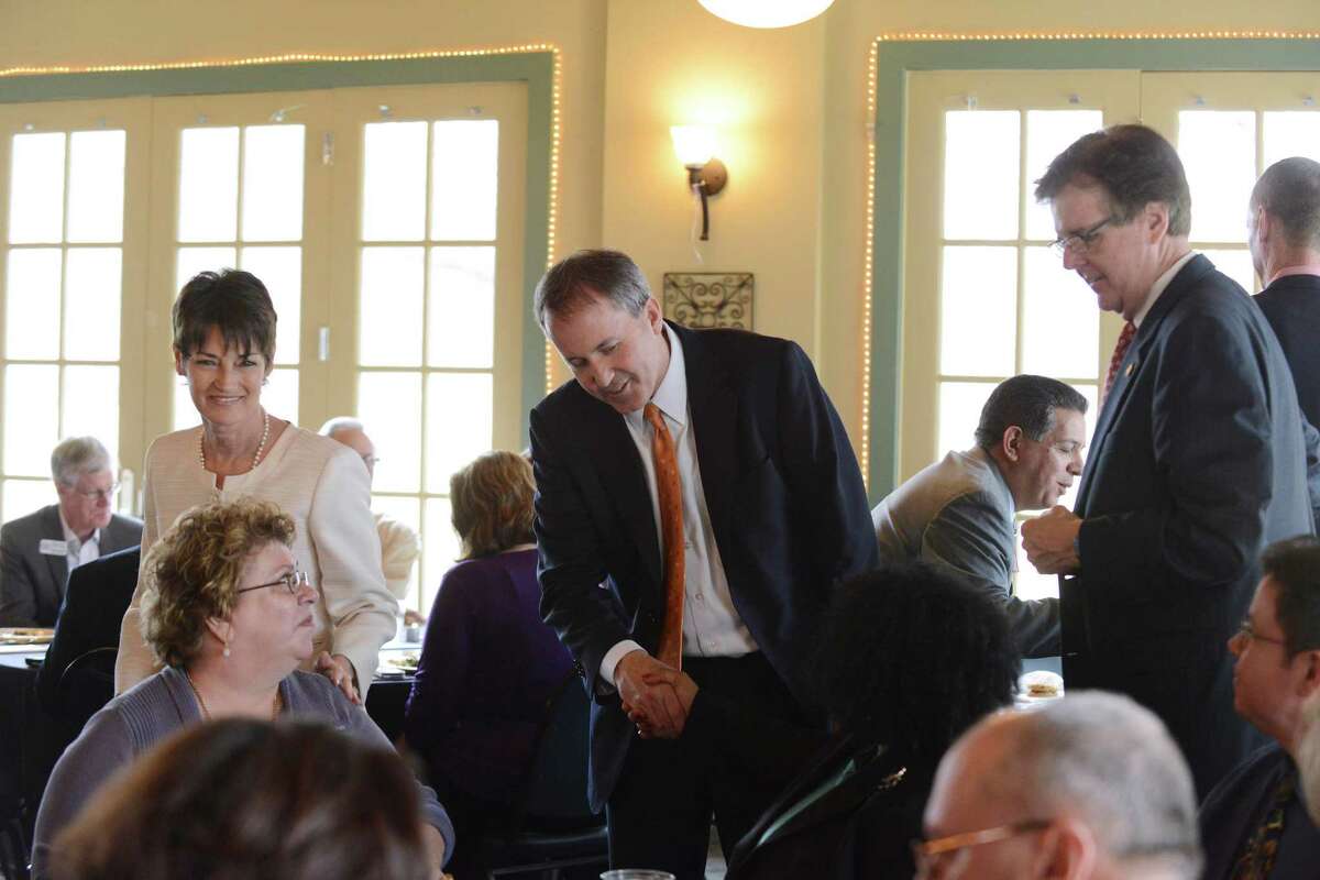 Republican candidates for office, Donna Campbell, left, who is running for reelection in Senate District 25, Ken Paxton, who is running for attorney general, and Dan Patrick, lieutenant governor candidate, meet people at a luncheon of the San Antonio Christian Business Chamber of Commerce at the Silverhorn Golf Club on Tuesday, Feb. 18, 2014