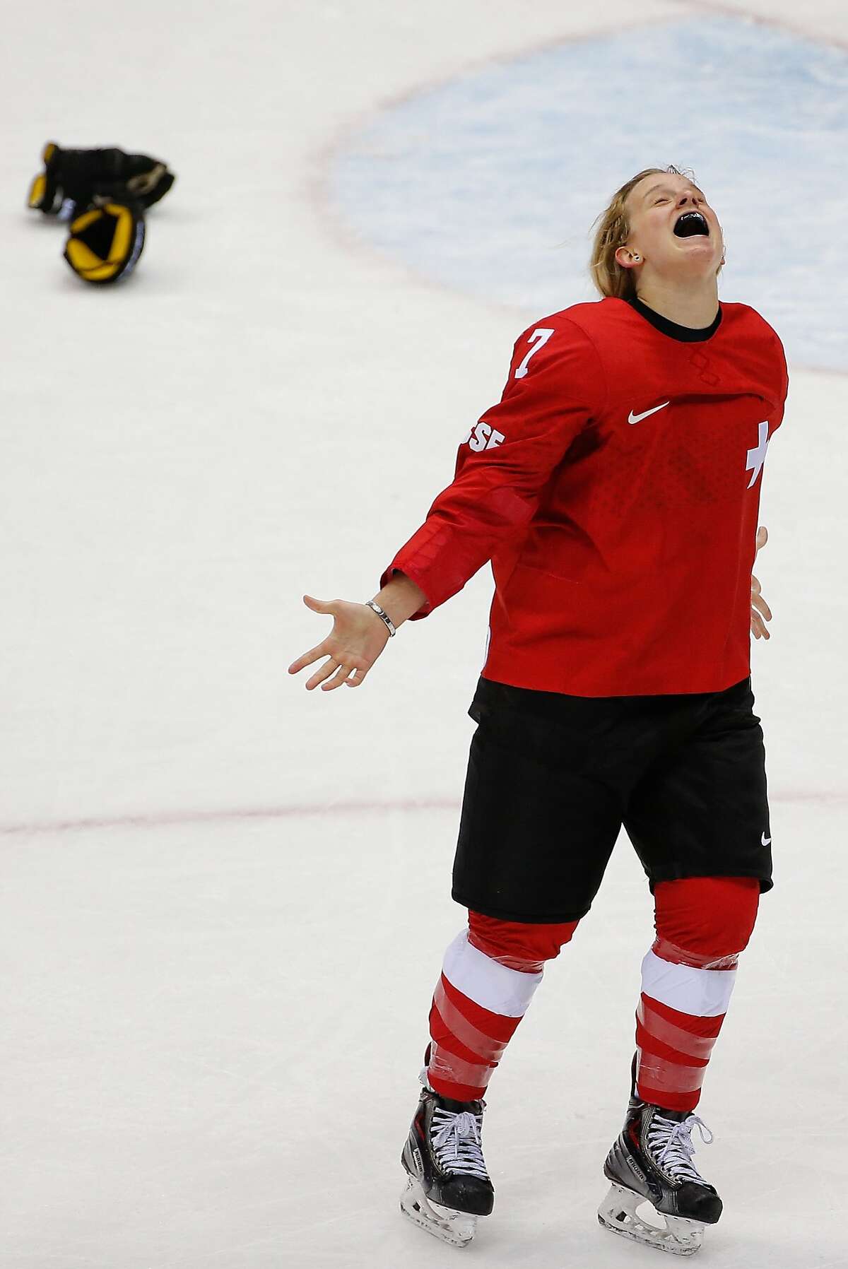 Lara Stalder of Switzerland (7) celebrates her team's 4-3 win over Sweden in the women's bronze medal ice hockey game at the 2014 Winter Olympics, Thursday, Feb. 20, 2014, in Sochi, Russia.