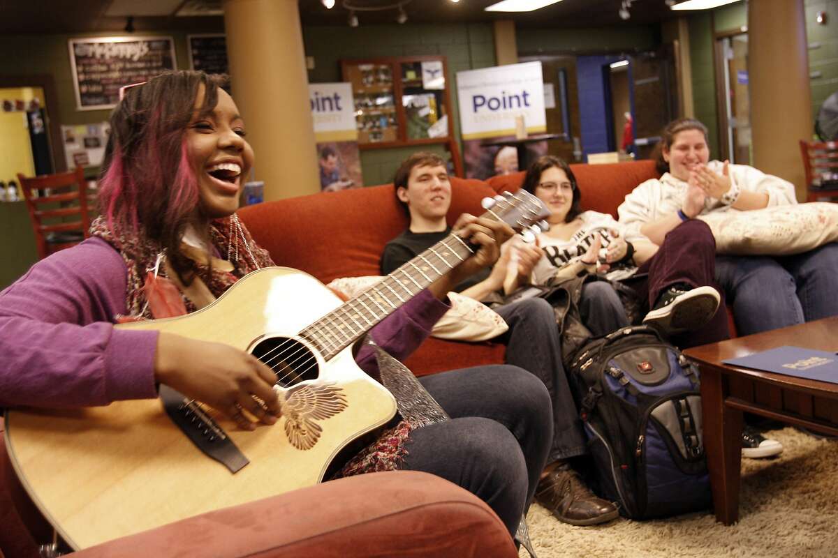 In this Jan. 17, 2012 photo, contemporary Christian recording artist Jamie Grace performs for friends at a coffee house in East Point, Ga. Grace's song "Hold Me," featuring TobyMac, is nominated for a Grammy Award for best contemporary Christian music song. (AP Photo/Greg Foster)