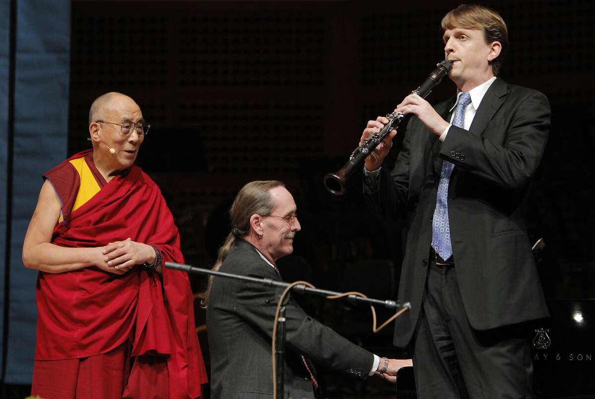 His Holiness the 14th Dalai Lama listens as pianist Robin Sutherland and clarinetist Carey Bell played as song before he spoke at Davies Symphony Hall in San Francisco, Calif., on Saturday, February 22, 2014, as part of The American Himalayan Foundation and the Blum Center for Developing Economies at UC Berkeley talk titled â€œThe Nature of Mind.â€