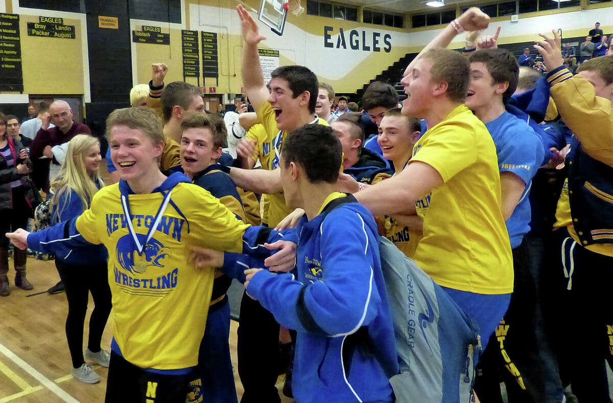 Newtown reacts after winning the CIAC Class LL Wrestling Championship at Trumbull High School on Saturday February 22, 2014. This is the first time in the school's history that it has won this event.