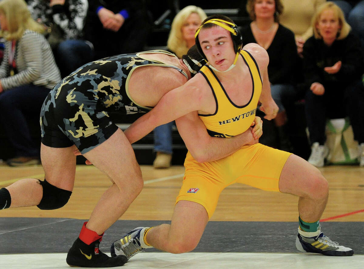 Newtown's Anthony Falbo wrestles against Trumbull's Steve Briganti, during CIAC Class LL Wrestling Championship action at Trumbull High School on Saturday February 22, 2014. Newtown took home the championship trophy for the first time in its history.