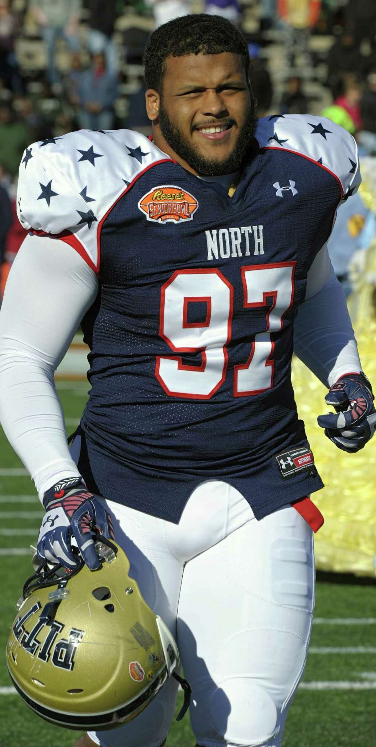 North defensive tackle Aaron Donald (97) of Pittsburgh runs on to the field before the Senior Bowl NCAA college football game on Saturday, Jan. 25, 2014, in Mobile, Ala. (AP Photo/G.M. Andrews)