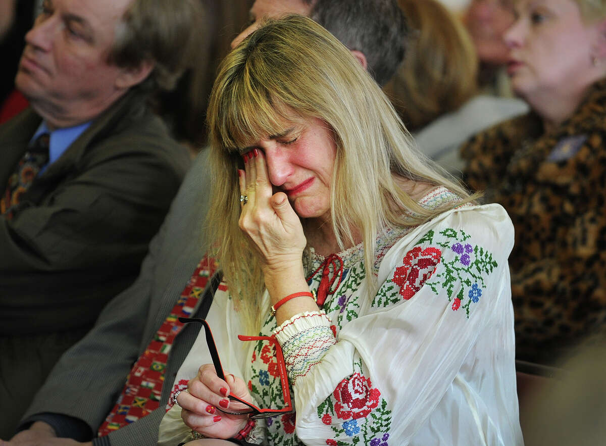 Congregant Hope Langer-Marshall, of Plainville, weeps as the names of Ukrainian dead are read aloud at a memorial service at St. Michael's Ukrainian Church in New Haven, Conn. on Sunday, February 23, 2014.