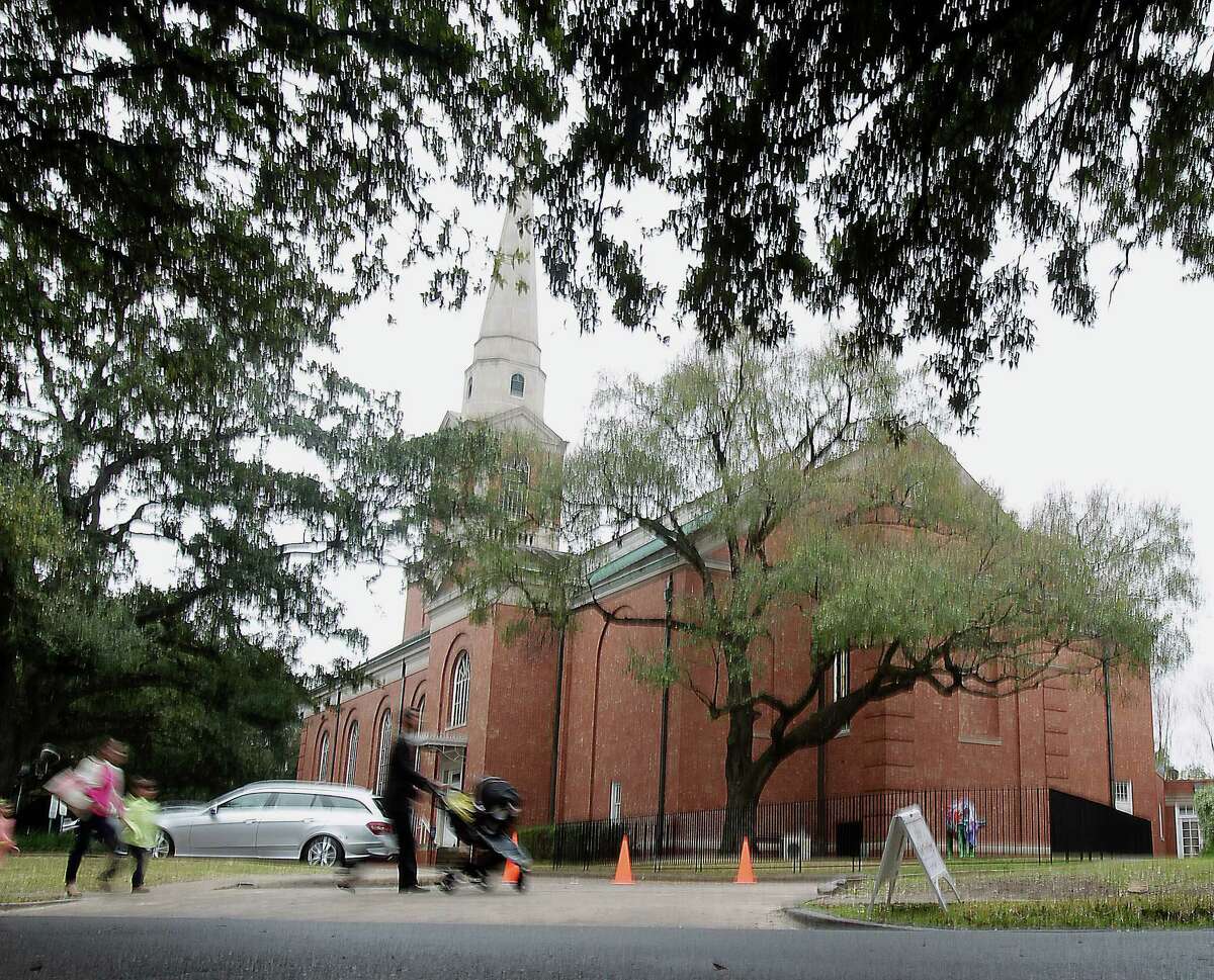 People arrive at First Presbyterian Church, today members are voting whether to leave its current denomination for a new one Sunday, Feb. 23, 2014, in Houston.