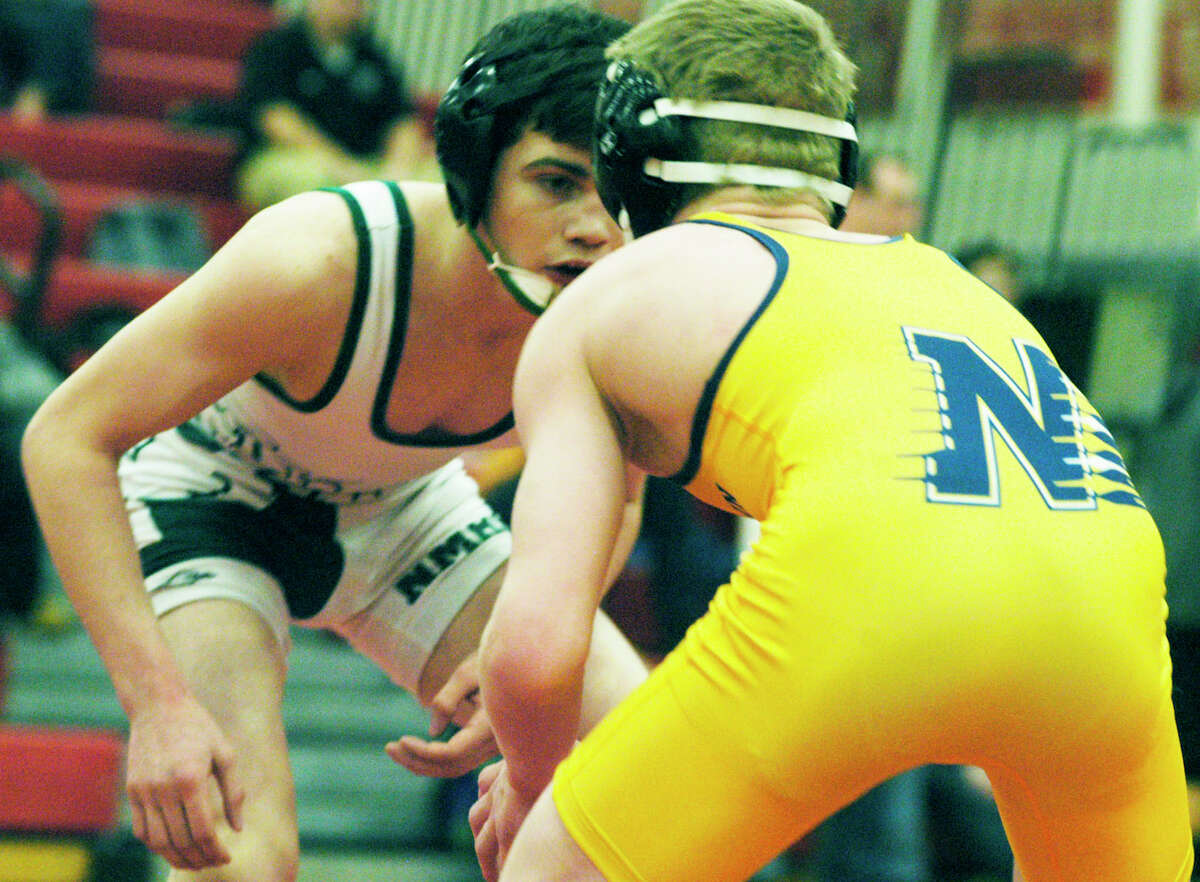 The Green Wave's Kyle Lindner stares down Ed Lovely of Newtown during the 113-pound weight class for New Milford High School wrestling at the South-West Conference championship tournament at Pomperaug High School in Southbury, Feb.16, 2014.