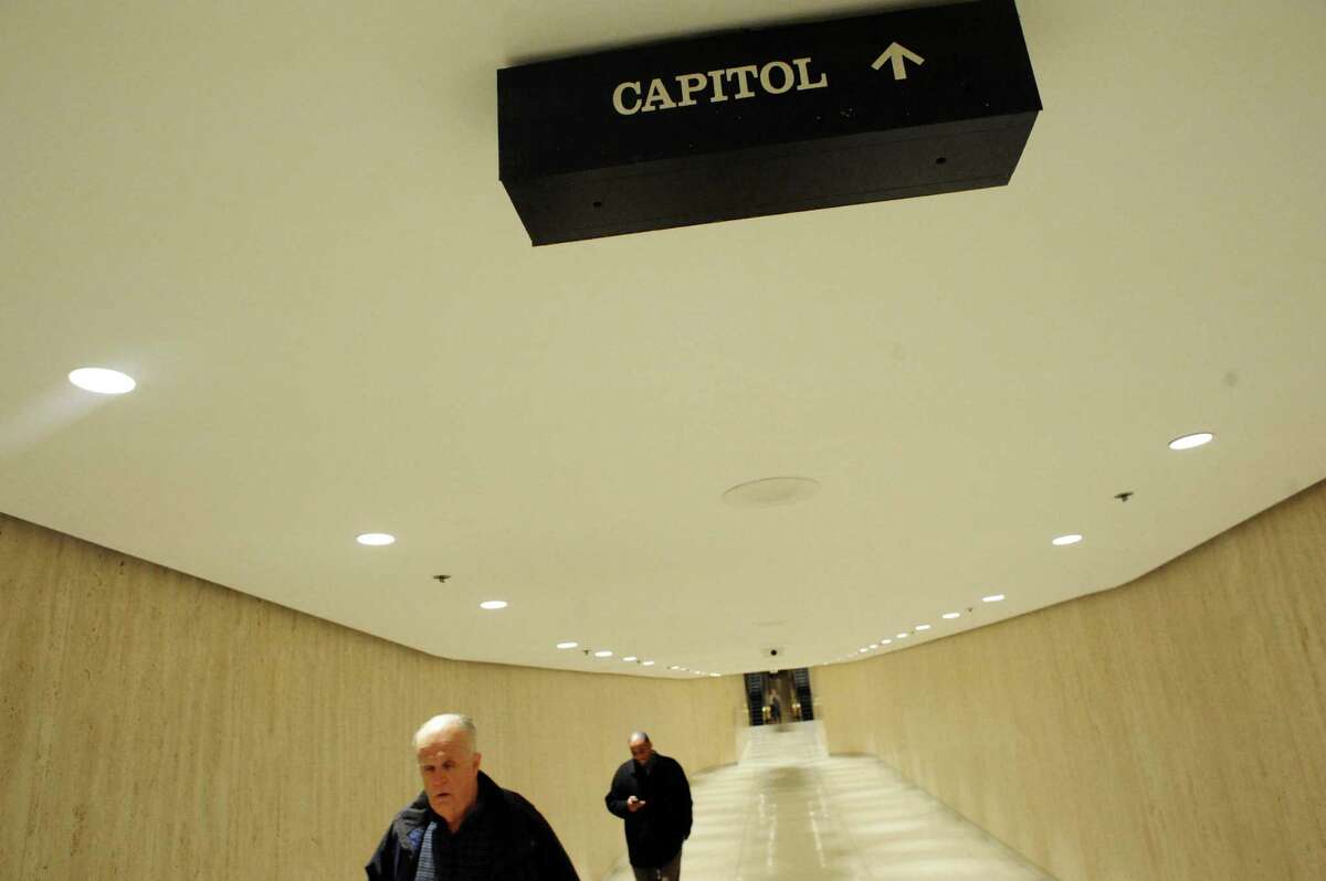 People make their way between the Empire State Plaza Concourse and Capitol building on Thursday, Feb. 20, 2014, in Albany, N.Y. (Michael P. Farrell/Times Union)
