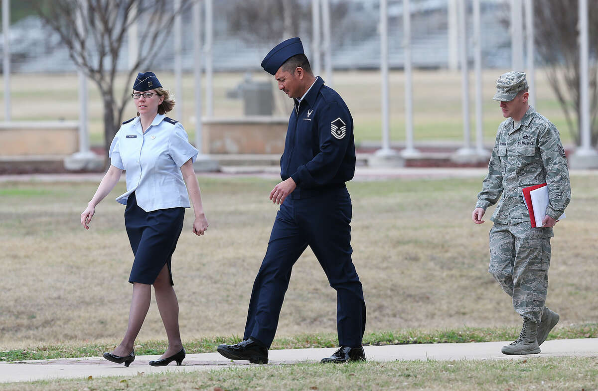 U.S. Air Force Master Sgt. Michael Silva, center, leaves an Article 32 hearing at Lackland Air Force, Monday, Feb. 24, 2013. Silva is charged with raping three women over the past 21 years. He faces life in prison if convicted.