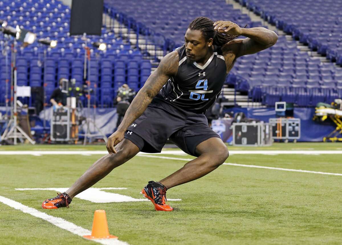 South Carolina defensive lineman Jadeveon Clowney runs a drill at the NFL football scouting combine in Indianapolis, Monday, Feb. 24, 2014. (AP Photo/Michael Conroy)
