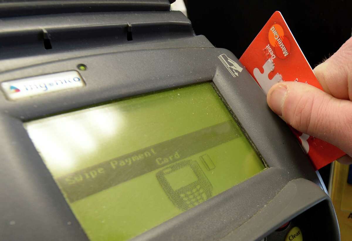 Photo Illustration of a credit card swipe unit Feb. 24, 2014, in Albany, N.Y. (Skip Dickstein/Times Union)
