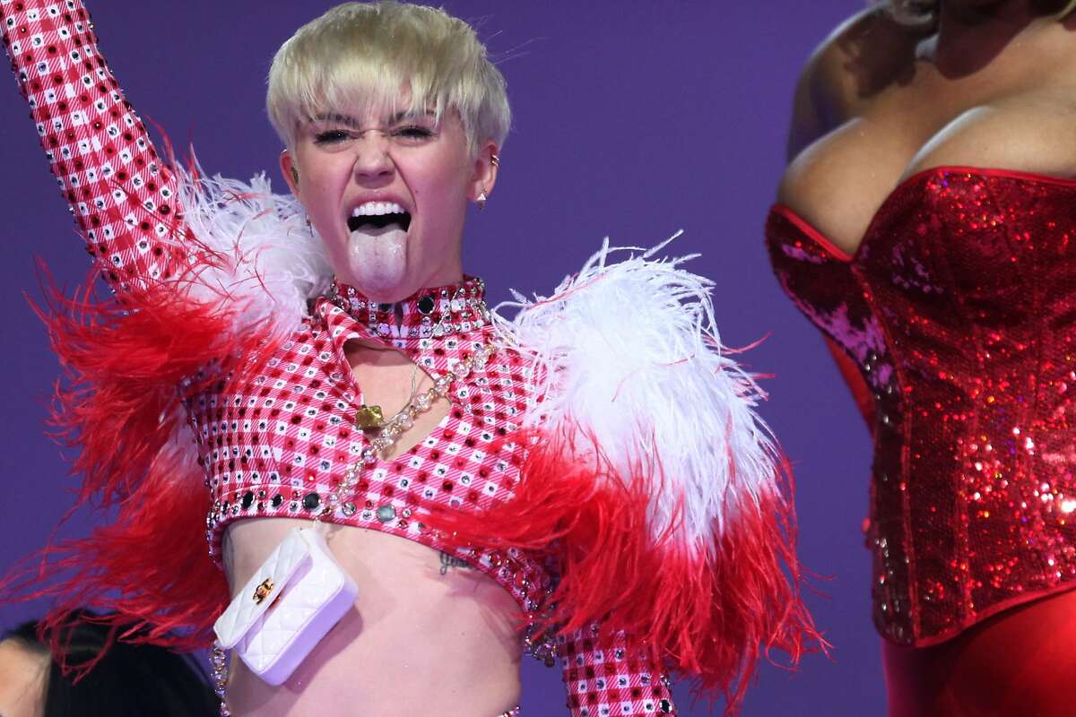 Miley Cyrus sticks out her tongue during her performance in Oakland on Feb. 24 2014.