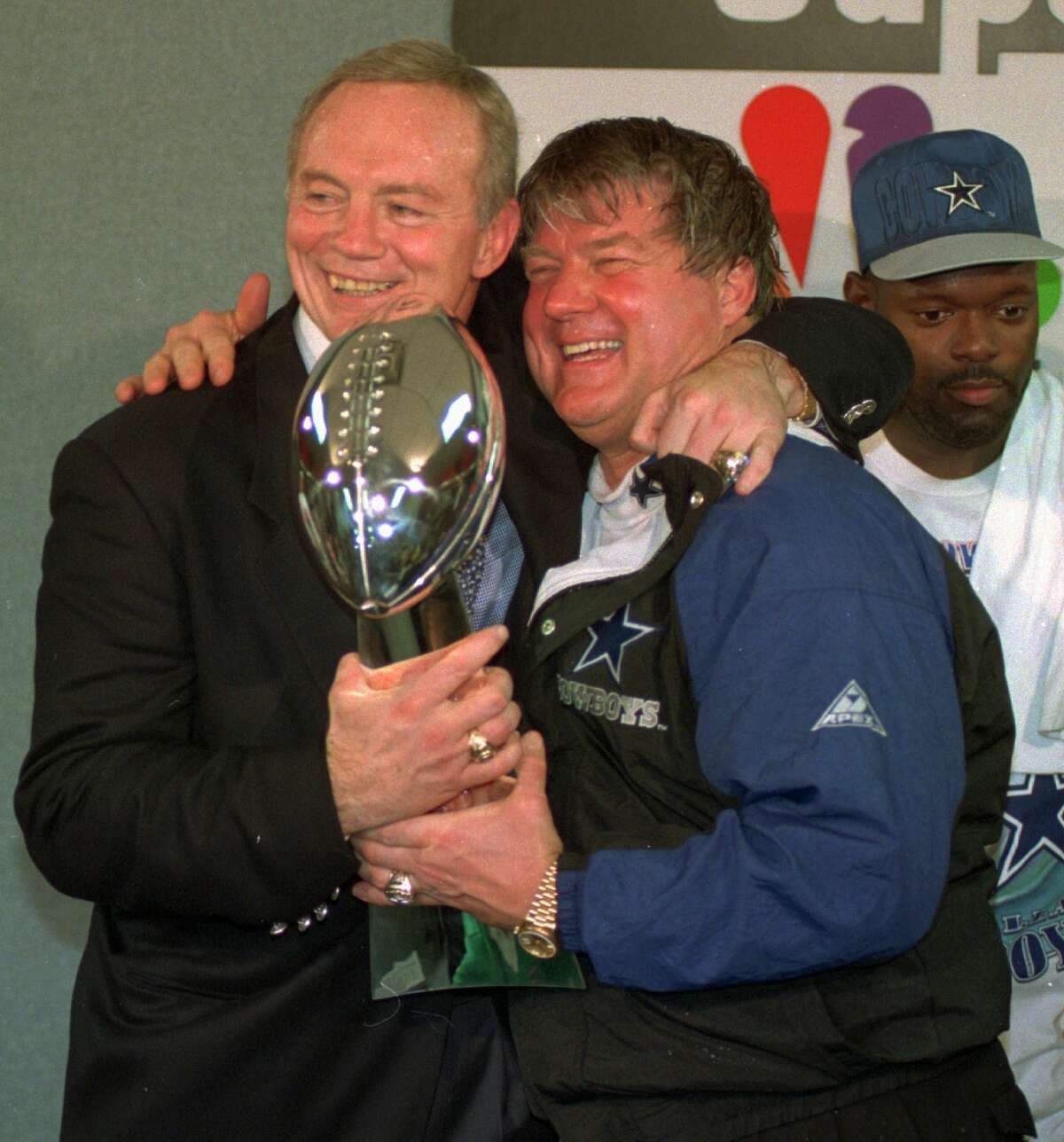 In this Jan. 30, 1994 file photo, Dallas Cowboys owner Jerry Jones, left, and coach Jimmy Johnson celebrate with the Vince Lombardi trophye fter defeating the Buffalo Bills 30-13 in Super Bowl XXVIII at the Georgia Dome in Atlanta. Johnson made 51 trades in his five years in Dallas, "more than the entire league put together," he proudly noted. That's how the Cowboys built the crux of their championship rosters.