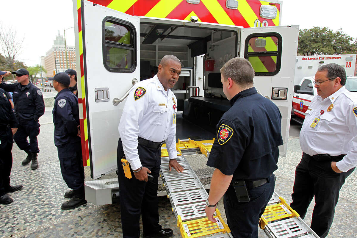 Fire Chief Charles Hood checks out new style ramps as SAFD unveils its new fleet of ambulances by rolling out 16 of the units at SAPD headquarters on February 25, 2014.